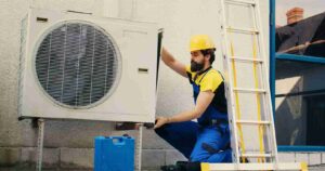 worker-works-air-conditioner