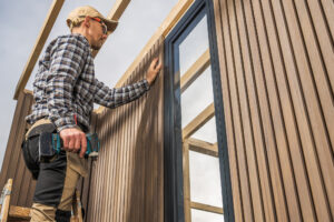 General Contractors in Pennsylvania installing composite siding on a modern home