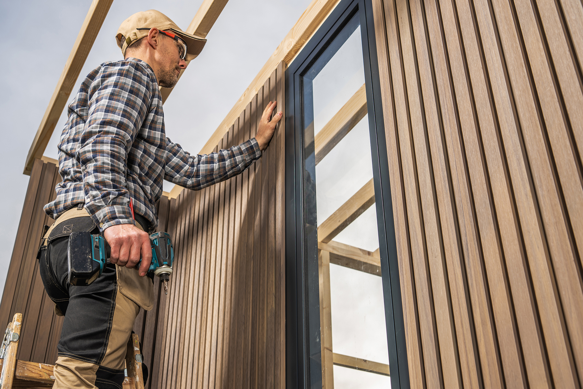 General Contractors in Pennsylvania installing composite siding on a modern home